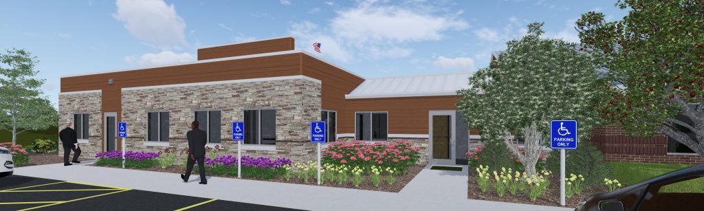 Modern commercial building exterior featuring stone and wood paneling, landscaped with colorful flowers, marked accessible parking spaces, and individuals approaching the entrance. Ideal for showcasing business services or community resources.