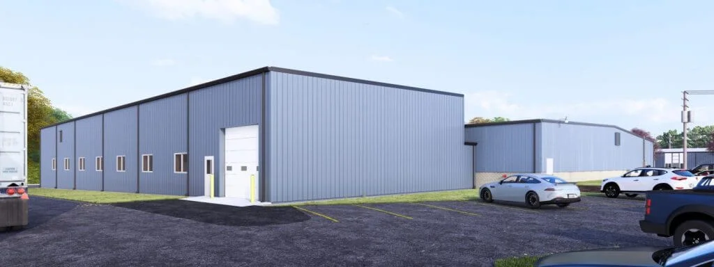New commercial metal building with loading dock and ample parking, featuring a sleek design and modern exterior. Ideal for businesses seeking spacious facilities.