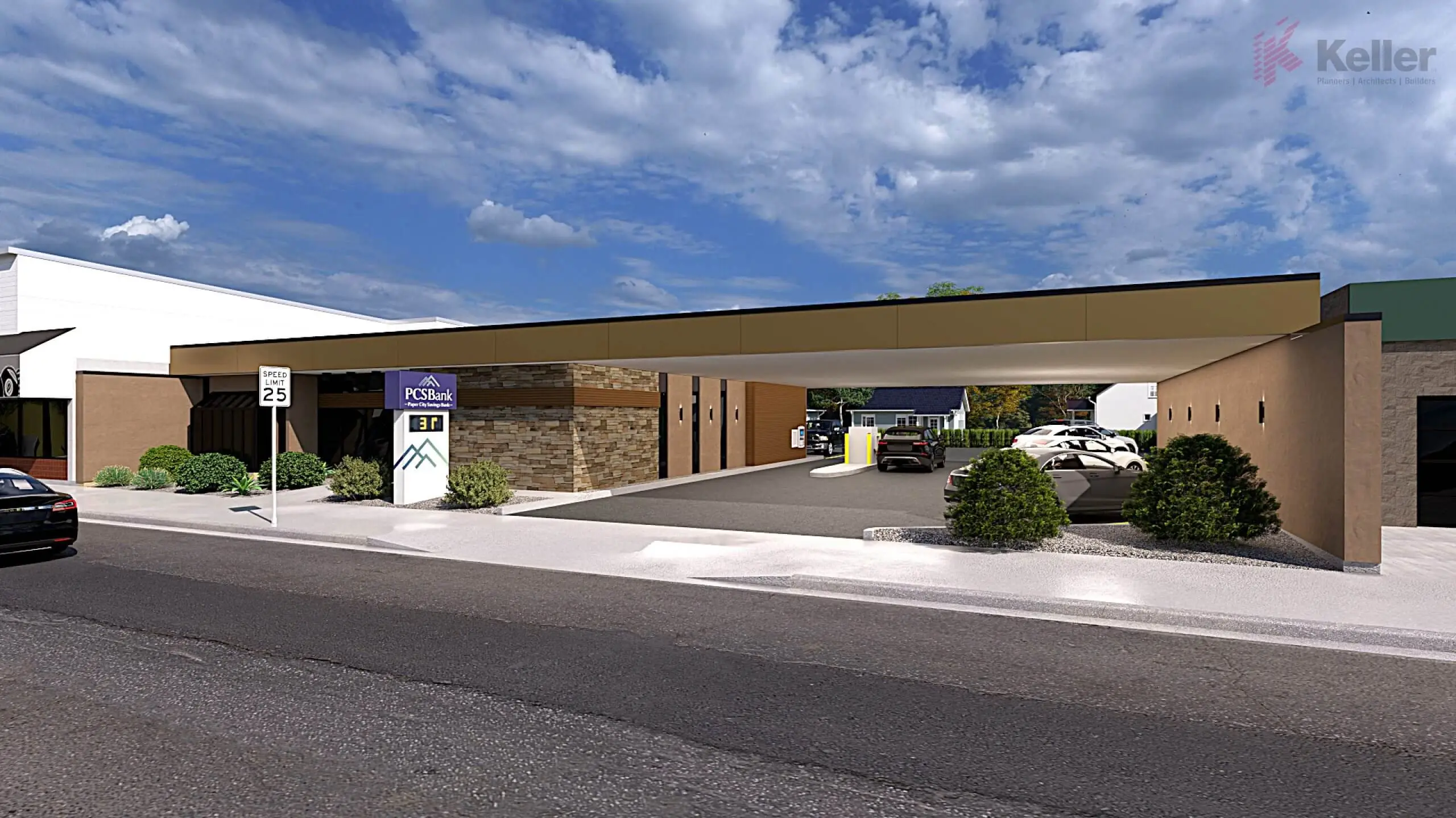 Exterior view of PCS Bank with a modern design, featuring a stone facade, canopy for drive-thru access, and landscaped shrubbery in front. The image showcases a clear day with blue skies above and street signage indicating a speed limit of 25 mph. Vehicles are parked in the lot, emphasizing the bank's accessibility.